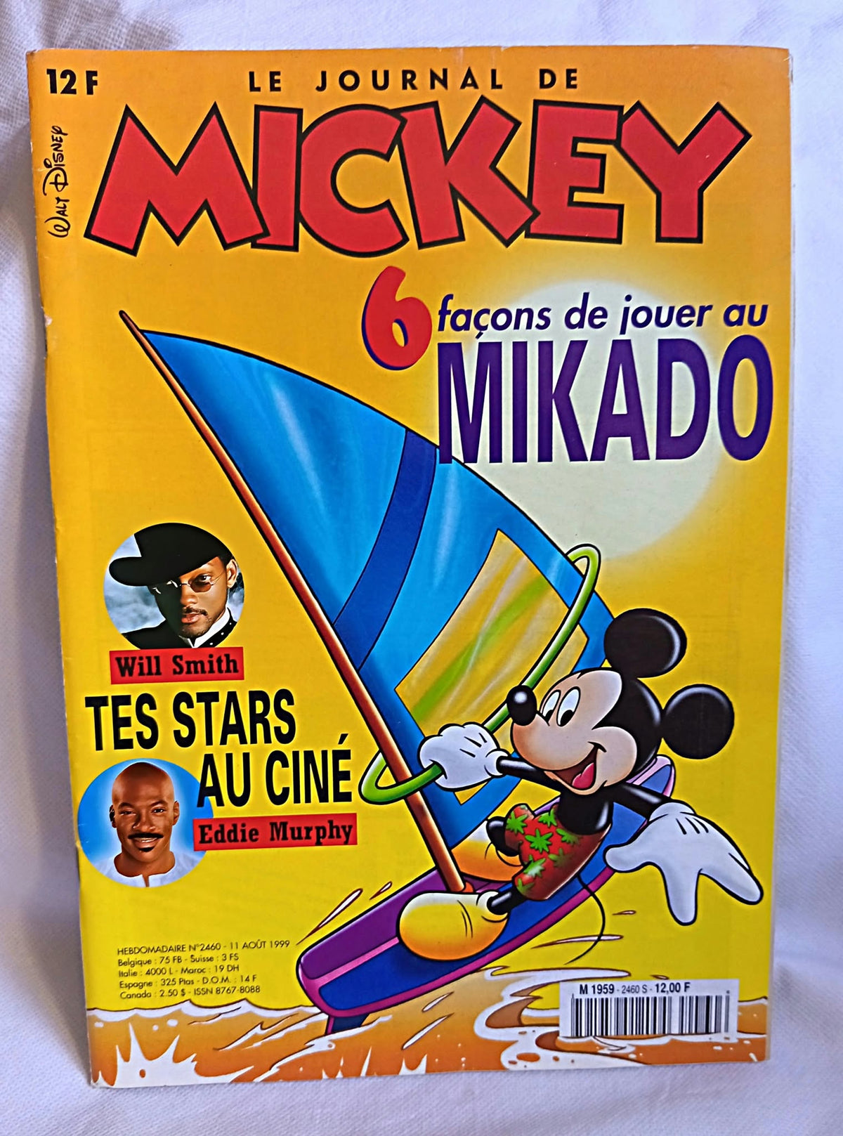 Couverture du Journal de Mickey numéro 2460 avec Mickey en planche à voile, Will Smith et Eddie Murphy