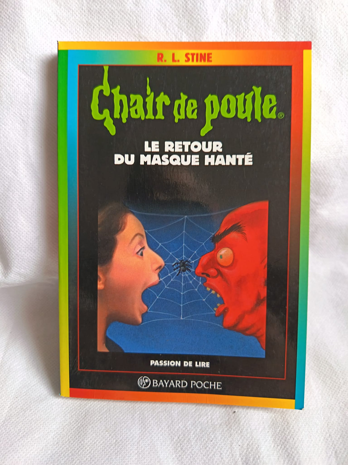 Couverture du livre Chair de Poule n°23 Le Retour du Masque Hanté, R.L. Stine
